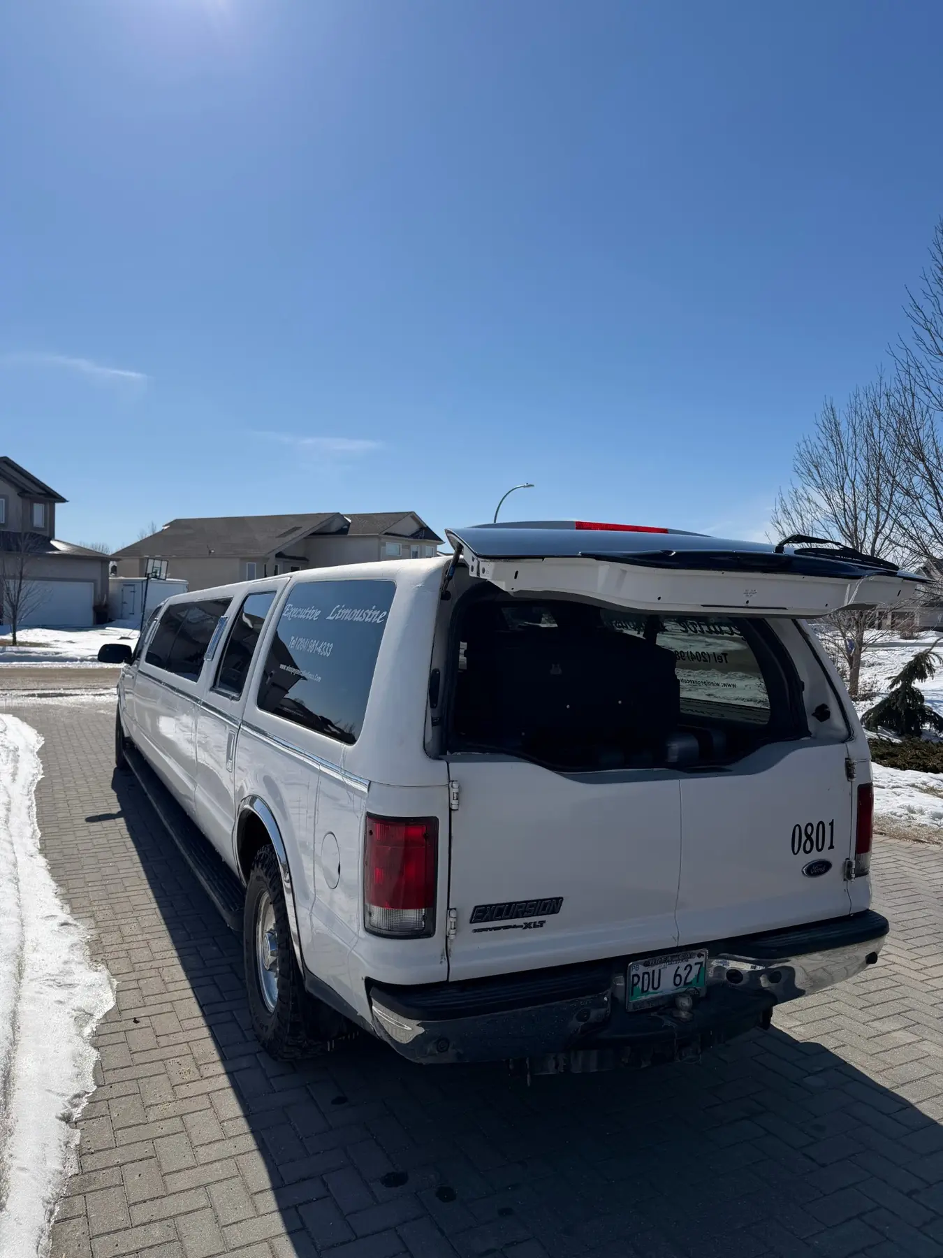 Rear of the Ford Excursion stretch limousine with the hatch open